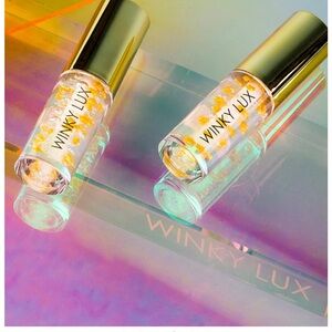 Winky Lux Lip Oil in Gold and Blue Packaging